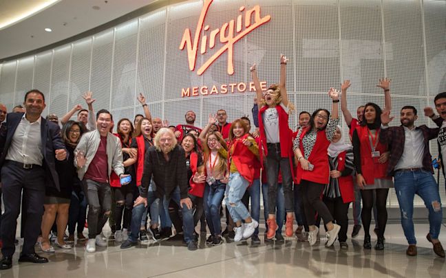 Richard Branson with Virgin Megastore employees