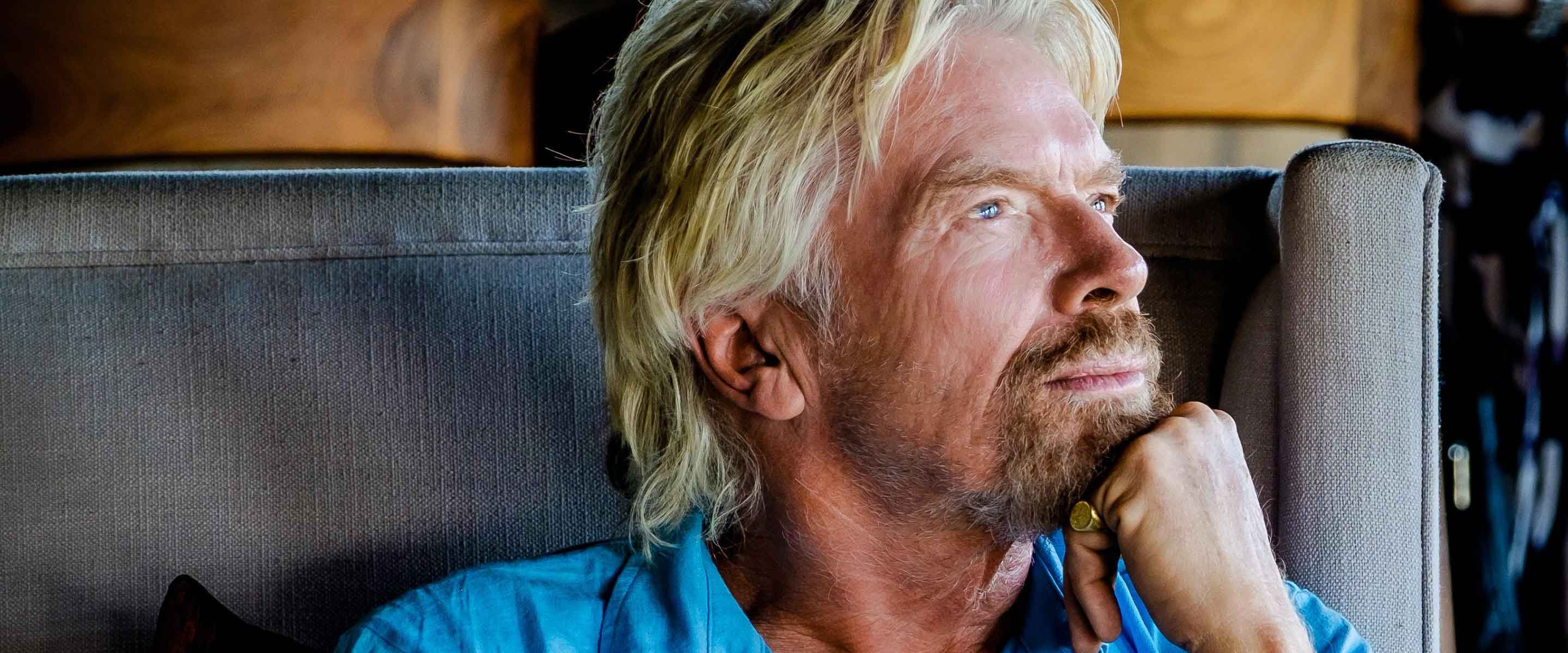 Richard Branson sitting down looking pensive