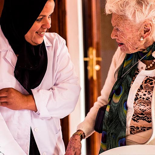 Eve Branson talking to a woman